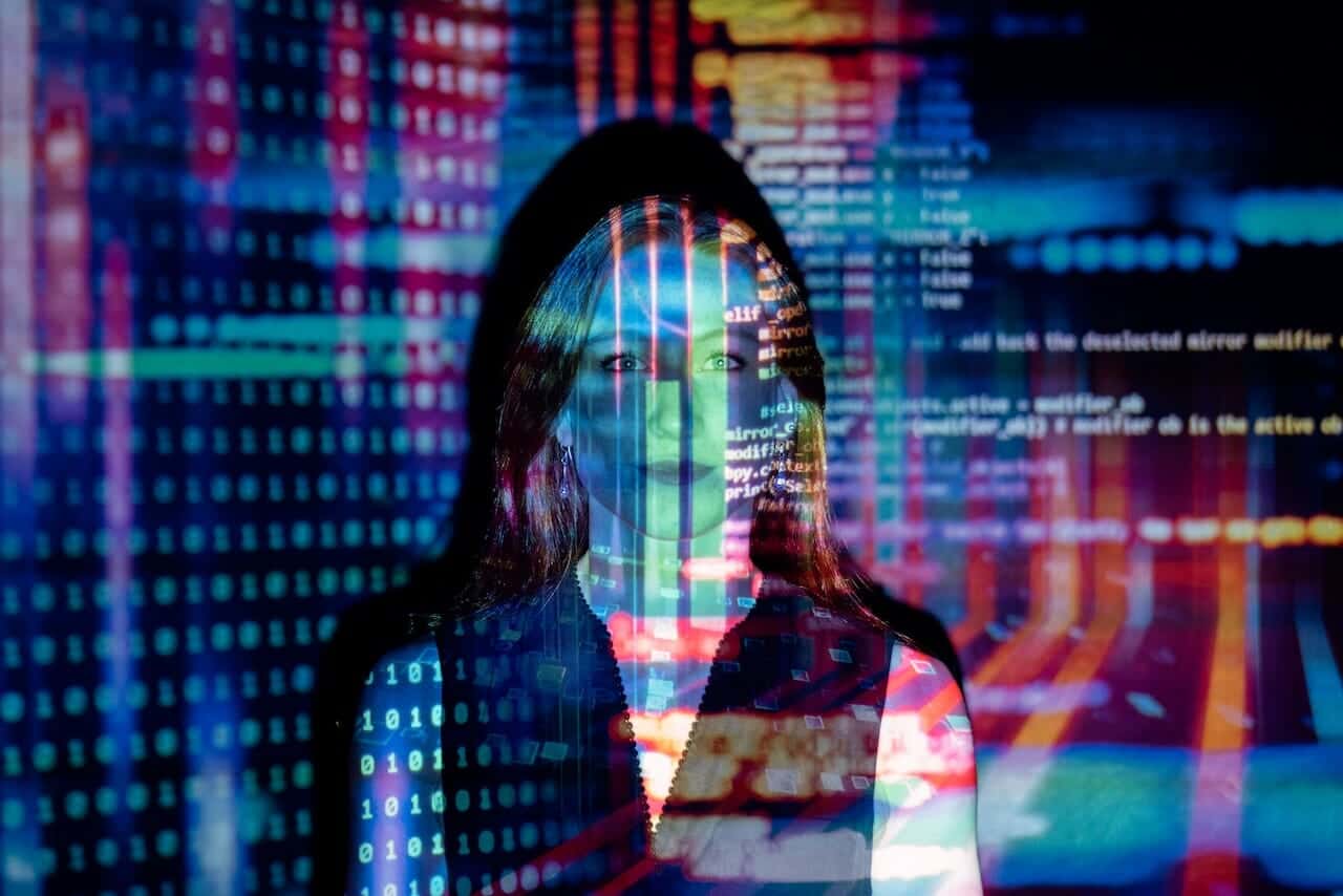 An image of a woman in front of a computer screen An image of a woman in front of a computer screen.